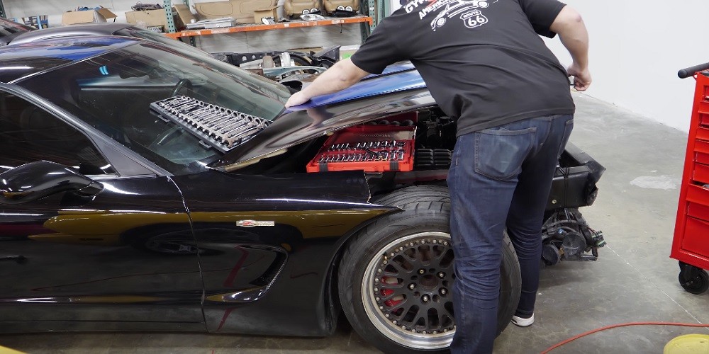 Rob Dahm meticulously prepares the C5 Z06 engine bay for LS6 removal.