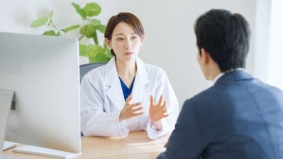 Doctor recommending a CT scan to a patient in Makassar