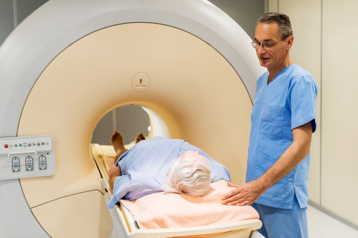 Medical professionals reviewing a medical scan, representing the common association of scans with radiation but highlighting the difference from car scans.