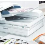 Scanning a document using a multifunction printer. Learn how to scan documents to your computer easily.