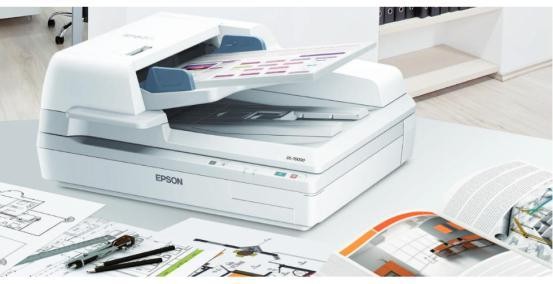 Paper documents being scanned on an Epson printer