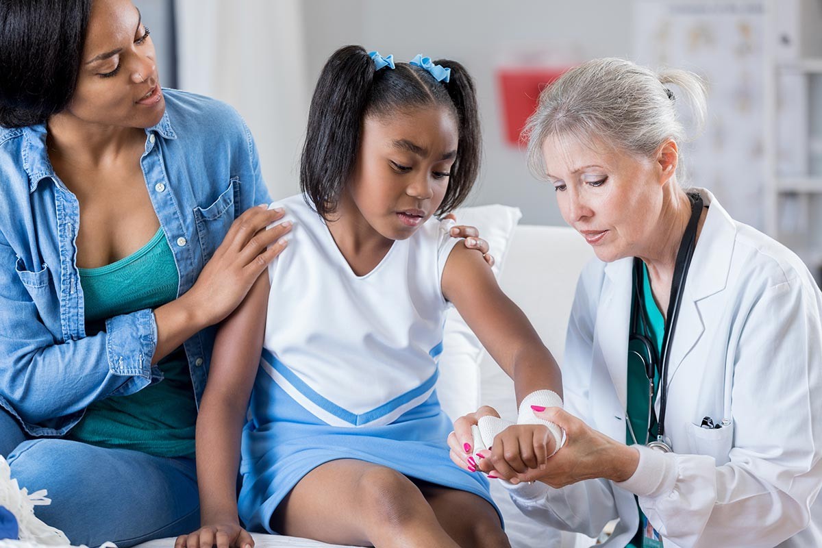 Mother and daughter visiting doctor