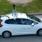 Street scan car equipped with advanced sensors assessing road conditions in Carmel, Indiana.