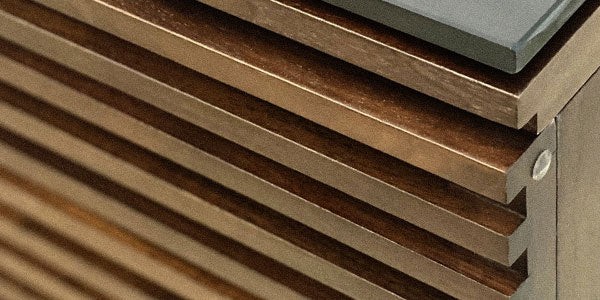 Close-up of teak wood grain showing natural oil